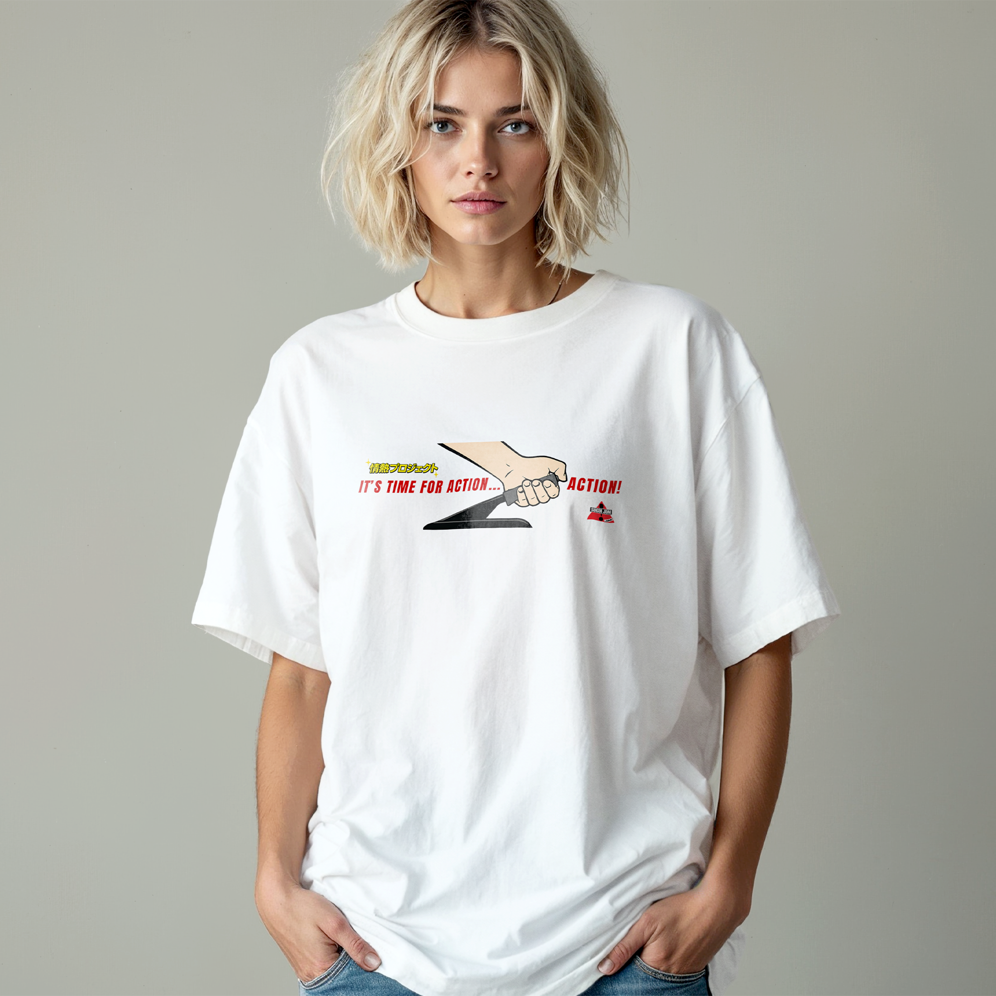 Person wearing a white t-shirt with a graphic design on a plain background