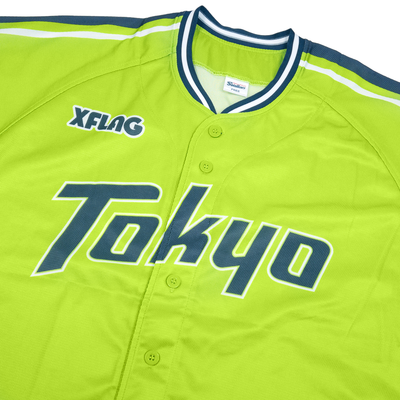 Green baseball jersey with 'Tokyo' printed on it, featuring XFLAG branding.